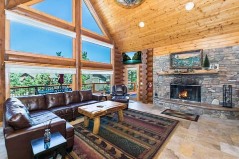 Living room features floor to ceiling windows.