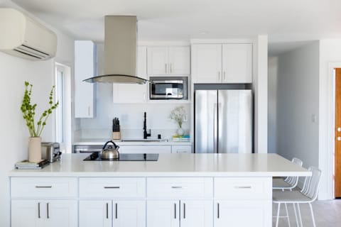 Unit 1 - Kitchen is modern and bright.