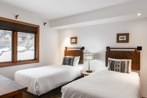 Bedroom 2 features two twin beds.