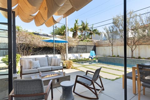 Hang by the pool under the shaded seating area.