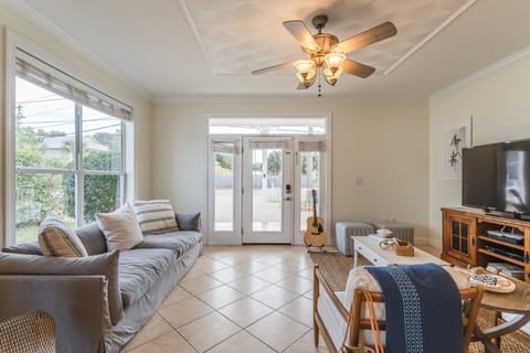 Living area features a comfy couch and TV.