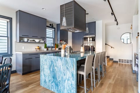 Modern and clean kitchen with vibrant blue marble countertops.