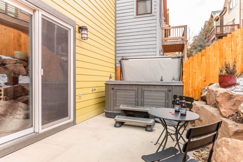 A spacious back patio and hot tub.