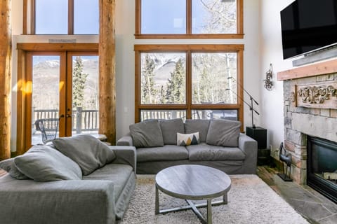 Floor-to-ceiling windows in the living room let in tons of natural light.