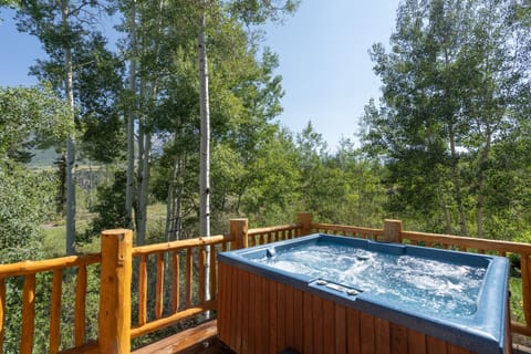 Hot tub with amazing views. The deck also features an outdoor sound system.