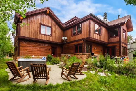 Gorgeous cabin exterior with outdoor living space.