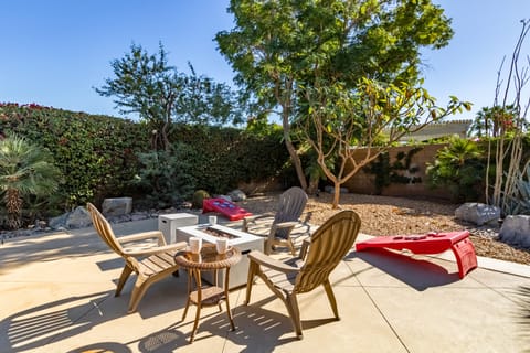 Firepit lounge and cornhole.