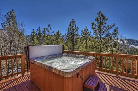 Hot tub with mountain views.