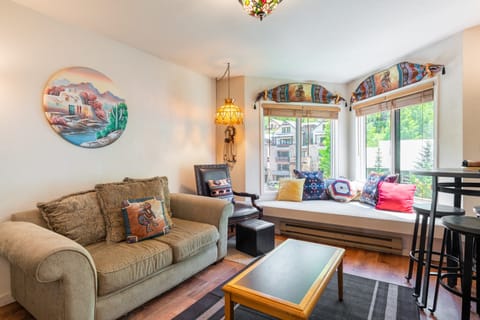 Bright and sunny living room with a bay window seat.
