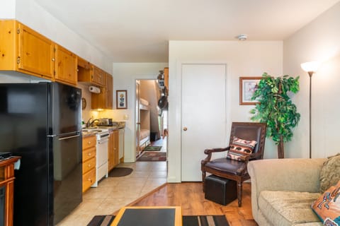 Beautiful condo with a living room and fully-equipped kitchen.