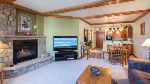 Cozy living room with a fireplace, comfortable seating and a TV to keep you entertained.