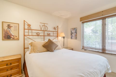 The primary bedroom features a queen bed.