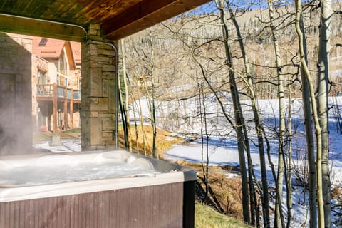 Hot tub with a mountain view.