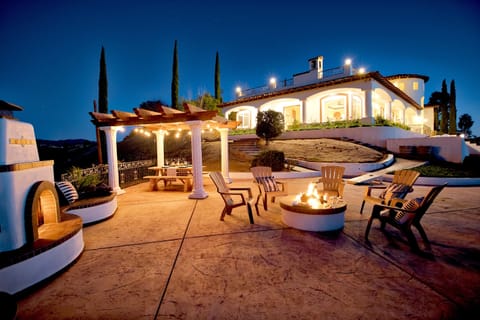 Enjoy the outdoor fireplace, dining area and cozy fire pit.