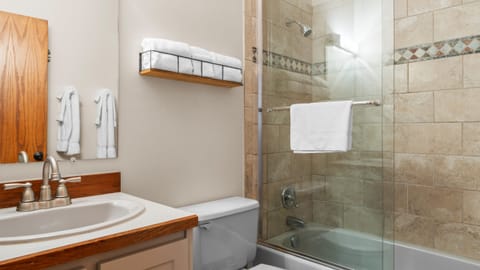 Full bathroom features a shower/tub combo.