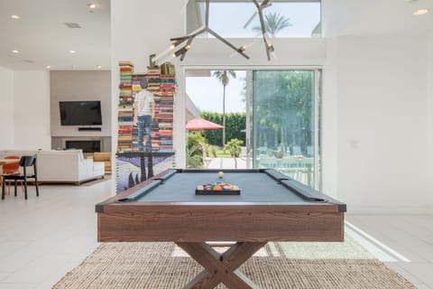 Upscale, luxe interior boasts plenty of ways to keep your group entertained, including a pool table surrounded by natural light.