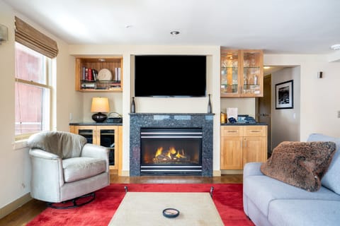 Living room features a fireplace.