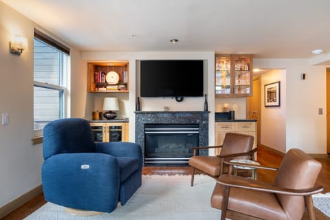 Living room features a fireplace.