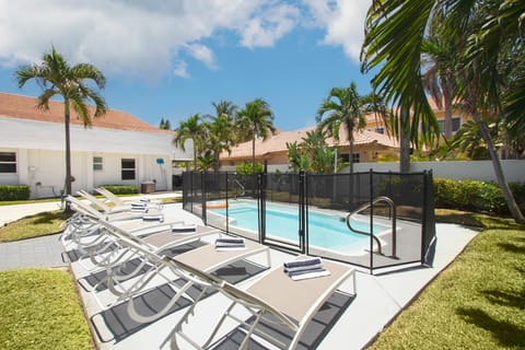 Fenced-in outdoor pool is family-friendly.