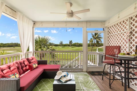 Enclosed porch features a dining table.
