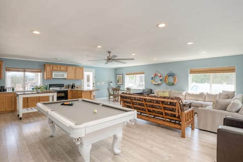 Living room in the guest house features a sitting area, pool table, dining area, and second kitchen.