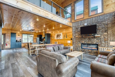 Living room features a fireplace and TV.