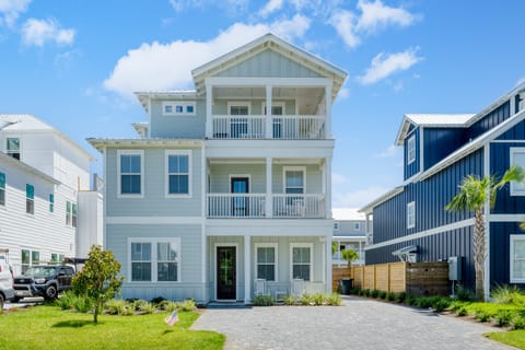 Chic, three-story home with multiple balconies.