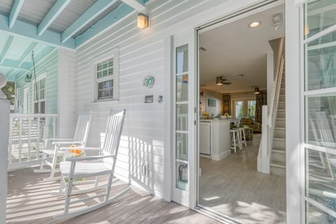 Balcony off the kitchen. Large doors let in fresh air.