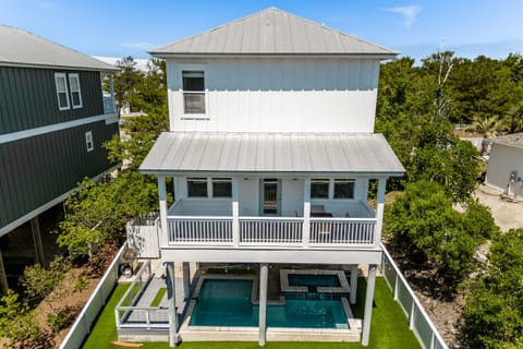 Covered pool, hot tub, and lower patio to enjoy the fresh air in any weather.