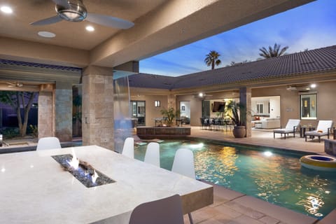 Firepit table near the pool.