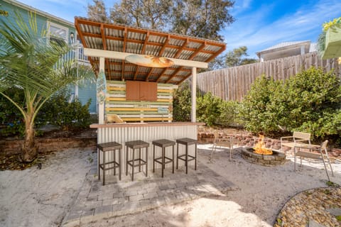 Outdoor bar, grill, and fire-pit.