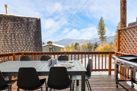 Tahoe B's patio features an outdoor dining table and mountain views.