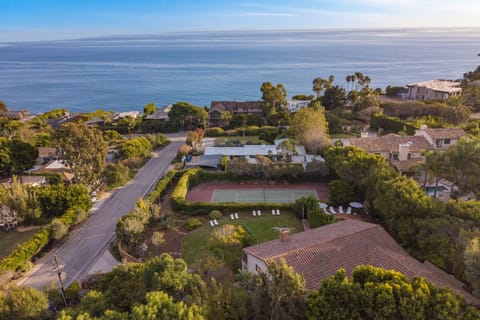 Steps to the beach with a private tennis court and beautiful views.