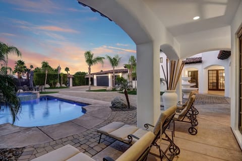 Sprawling house with a gorgeous backyard, pool, and hot tub.