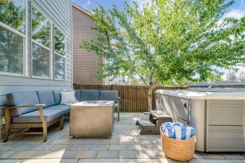 Hot tub and electric fire pit in the backyard.