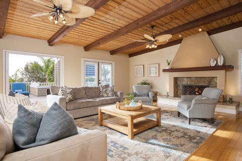 Living room features a fireplace and TV.