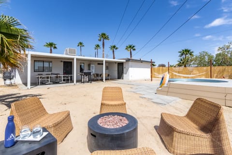 Patio features comfortable seating and a ping-pong table.