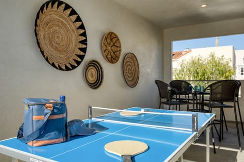 Second patio features ping pong and a table.