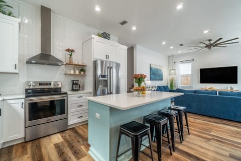 Spacious kitchen with barstool seating at the island.