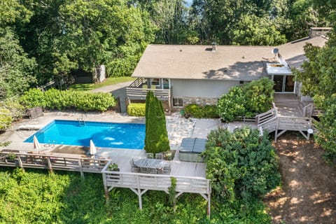 Living room features floor-to-ceiling windows, a telescope, and a fireplace.