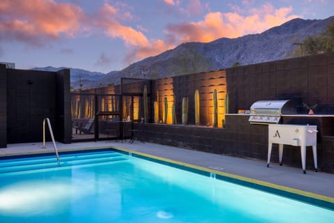 Communal pool area with BBQ.