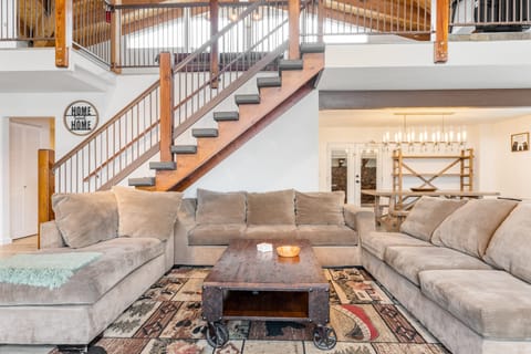 LIving room features a large sectional to fit your whole group.