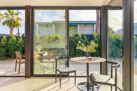 Small table near the windows.