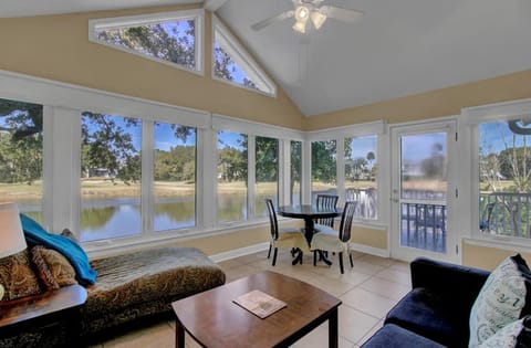 Sunroom with lagoon and golf views.