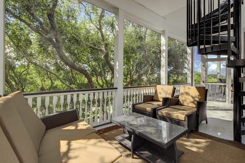 Experience tranquility on the screened in porch.