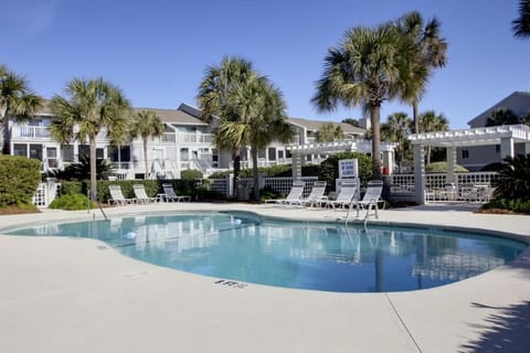 Jump in the Beach Club Villa's pool.