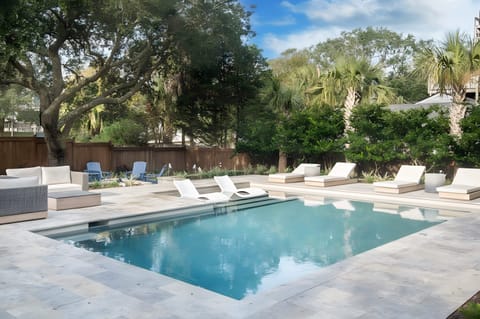 Pool with plenty of seats for everyone to relax.