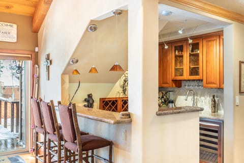 Cozy corner bar in the living room is the perfect place to grab a drink.