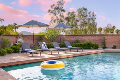 Backyard features a pool.