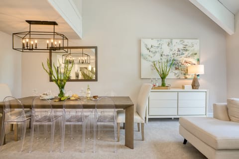 Elegant dining area with trendy acrylic seating.